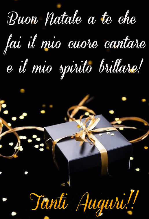 Immagine dai colori scuri e regalo di natale con tanti cuoricini e frase d'amore da dedicare.