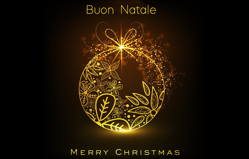 Immagine di una pallina di natale decorata e luminosa con auguri di Buone feste in italiano e inglese